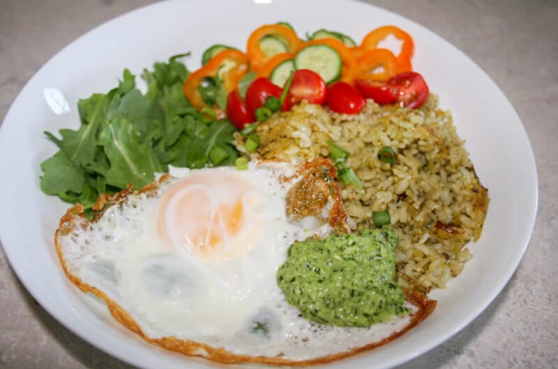 Pesto Fried Rice with a fried egg, peppers and arugula
