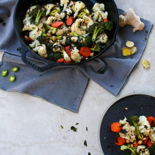 roasted vegetables with brown butter nori in a cast iron skillet and served on a plate