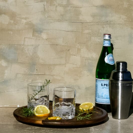 Rosemary Gin Fizz cocktail set up with Prosecco
