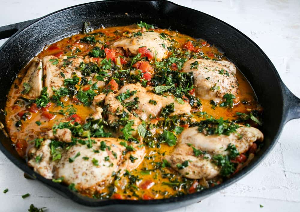 Za'atar Pan Roasted Chicken cooked in a cast iron skillet. overhead shot