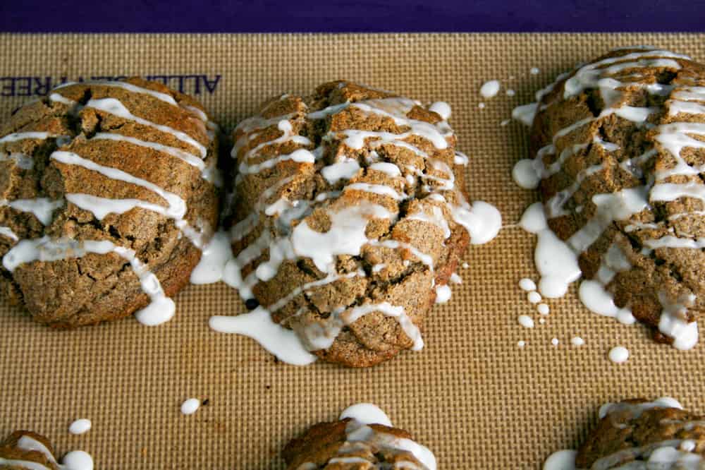 Buckwheat Chai Spiced Scones on the baking tray, freshly frosted