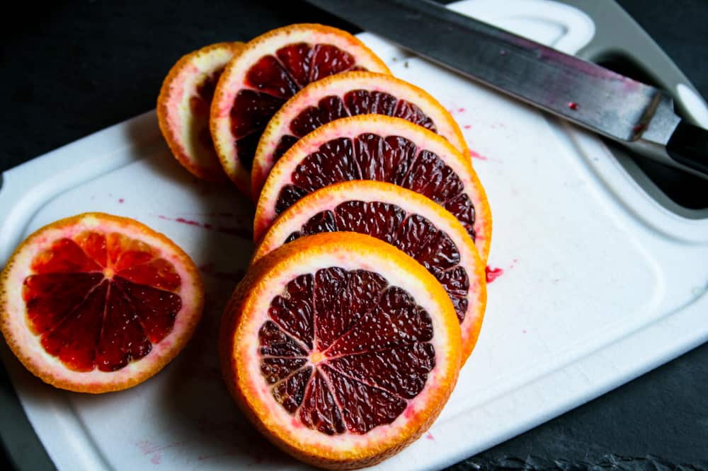 Blood orange slices on a cutting board