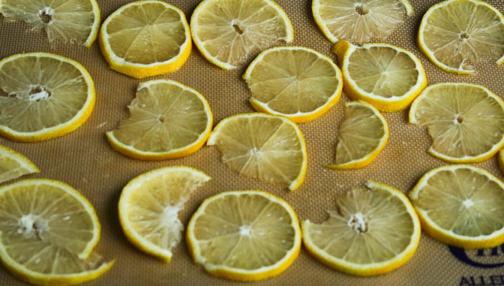 Sliced lemons on a baking tray