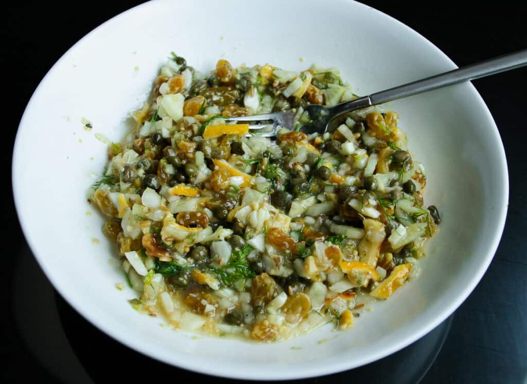 Lemon Caper Chutney in a bowl mixed with a fork