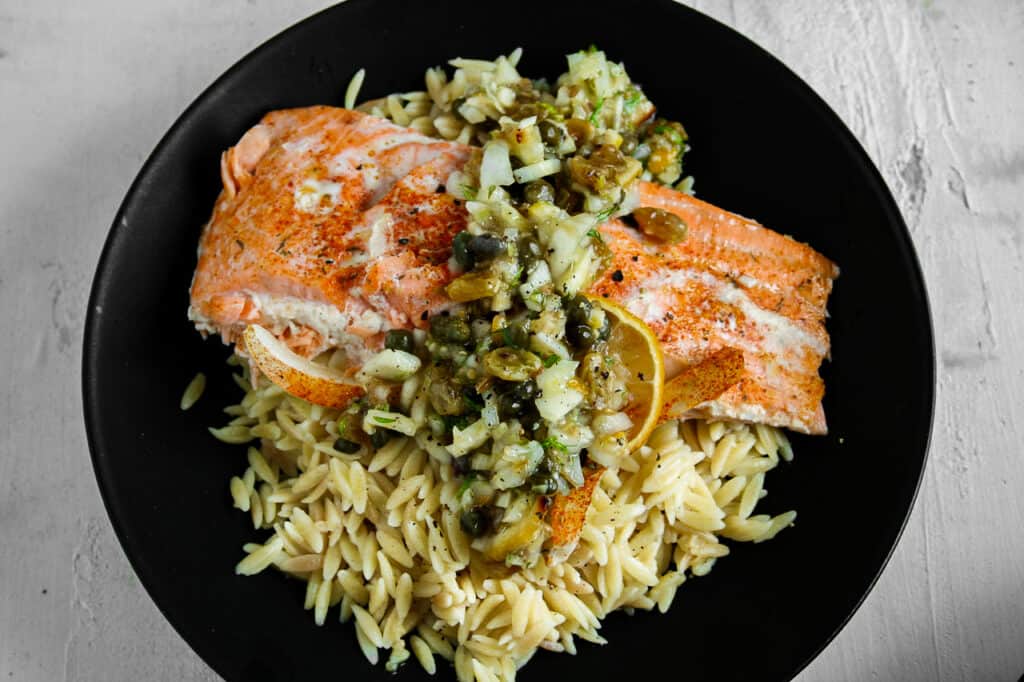 Salmon Filet with lemon caper chutney over orzo