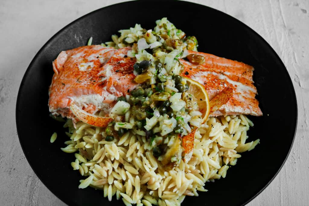 Salmon Filet with lemon caper chutney over orzo