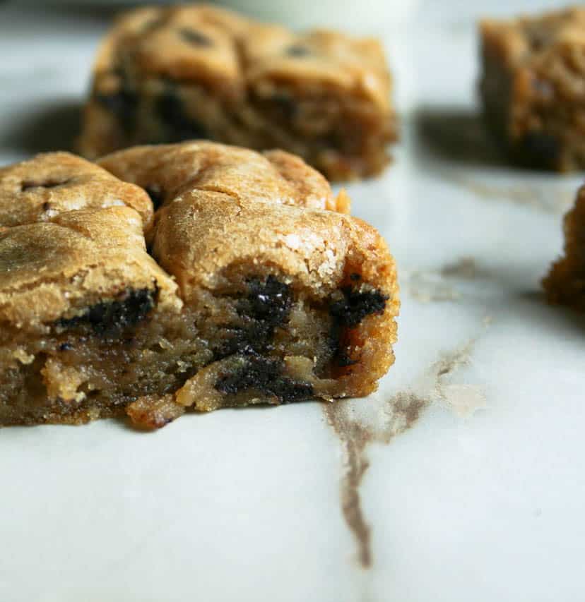 Crinkle Top Blondie with chocolate chips. photograph of blondie cut into squares