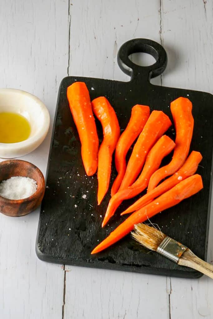 Process Shot for Grilled Mediterranean Carrots. Brushing with olive oil