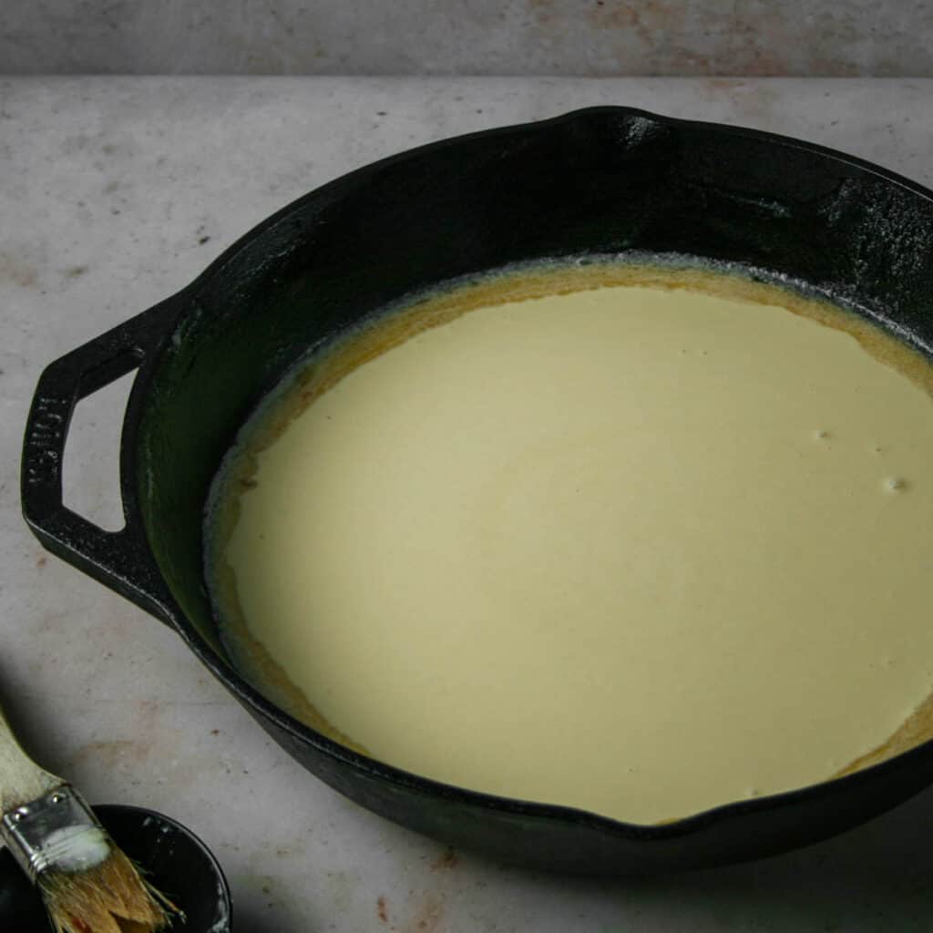 Batter for savory dutch baby in a cast iron skillet