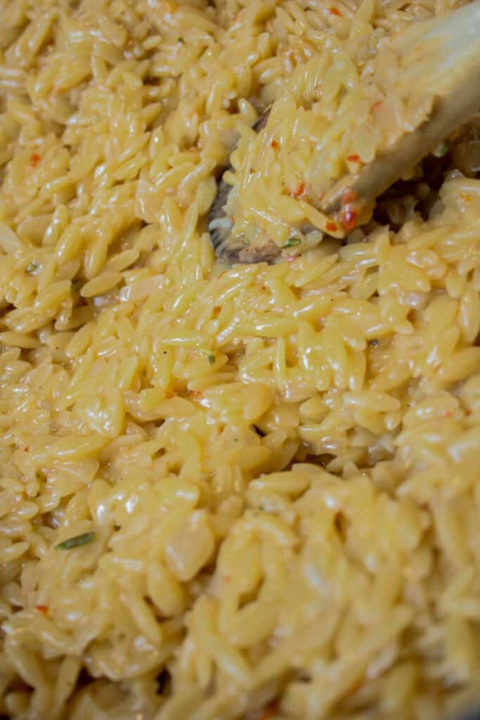 Close up photo of creamy rosemary orzo with shrimp