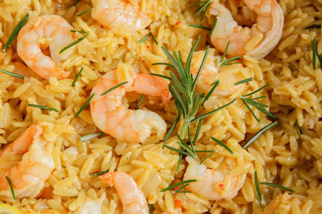photograph of orzo being toasted for creamy rosemary orzo with shrimp dish