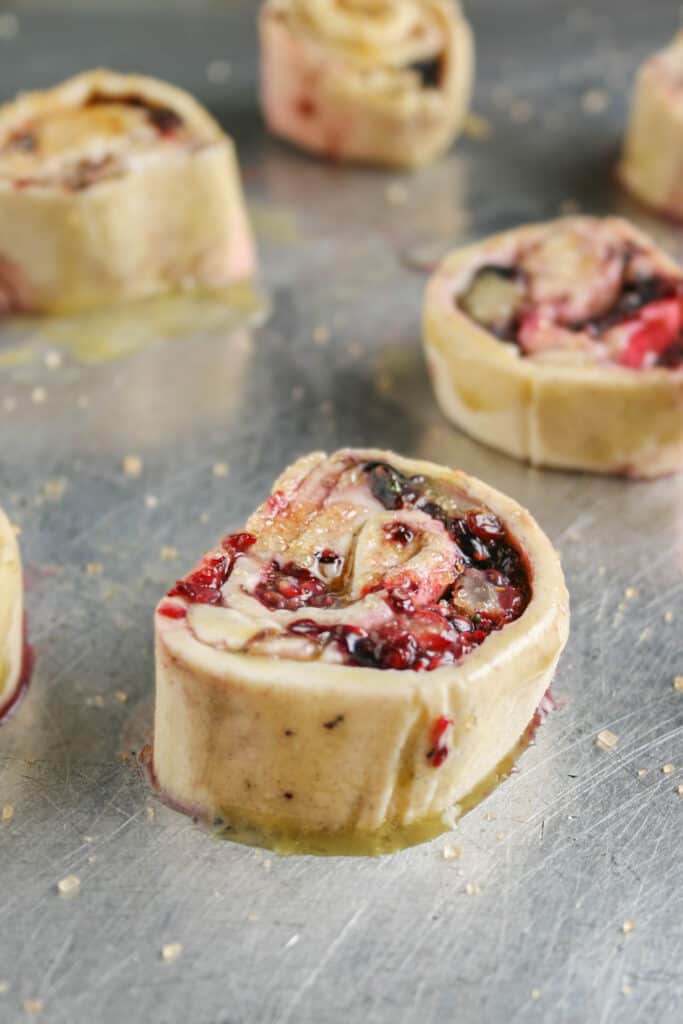 Photo of Blackberry Brie Pinwheel on a baking tray before baking