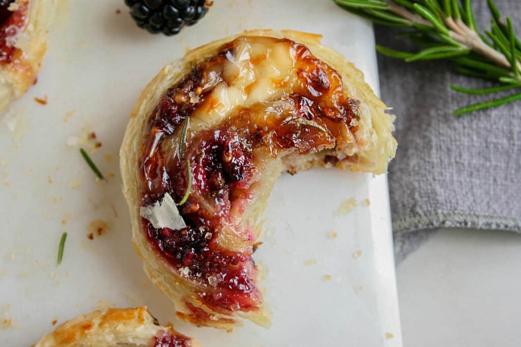 Photo of Photograph of Blackberry Brie Pinwheel with a bite taken out