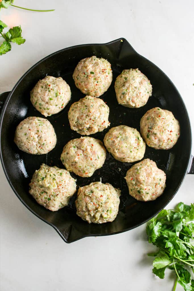 Thai meatballs scooped into balls and ready to bake