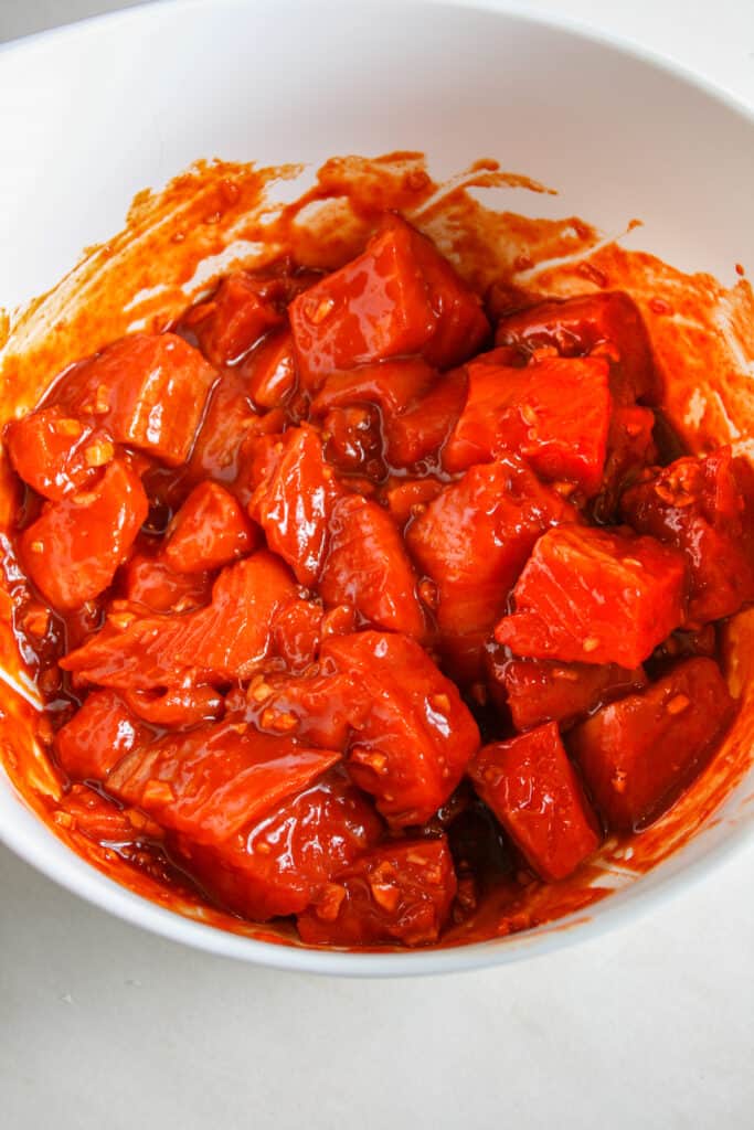 Salmon cubes in spicy marinade for spicy salmon rice bowls