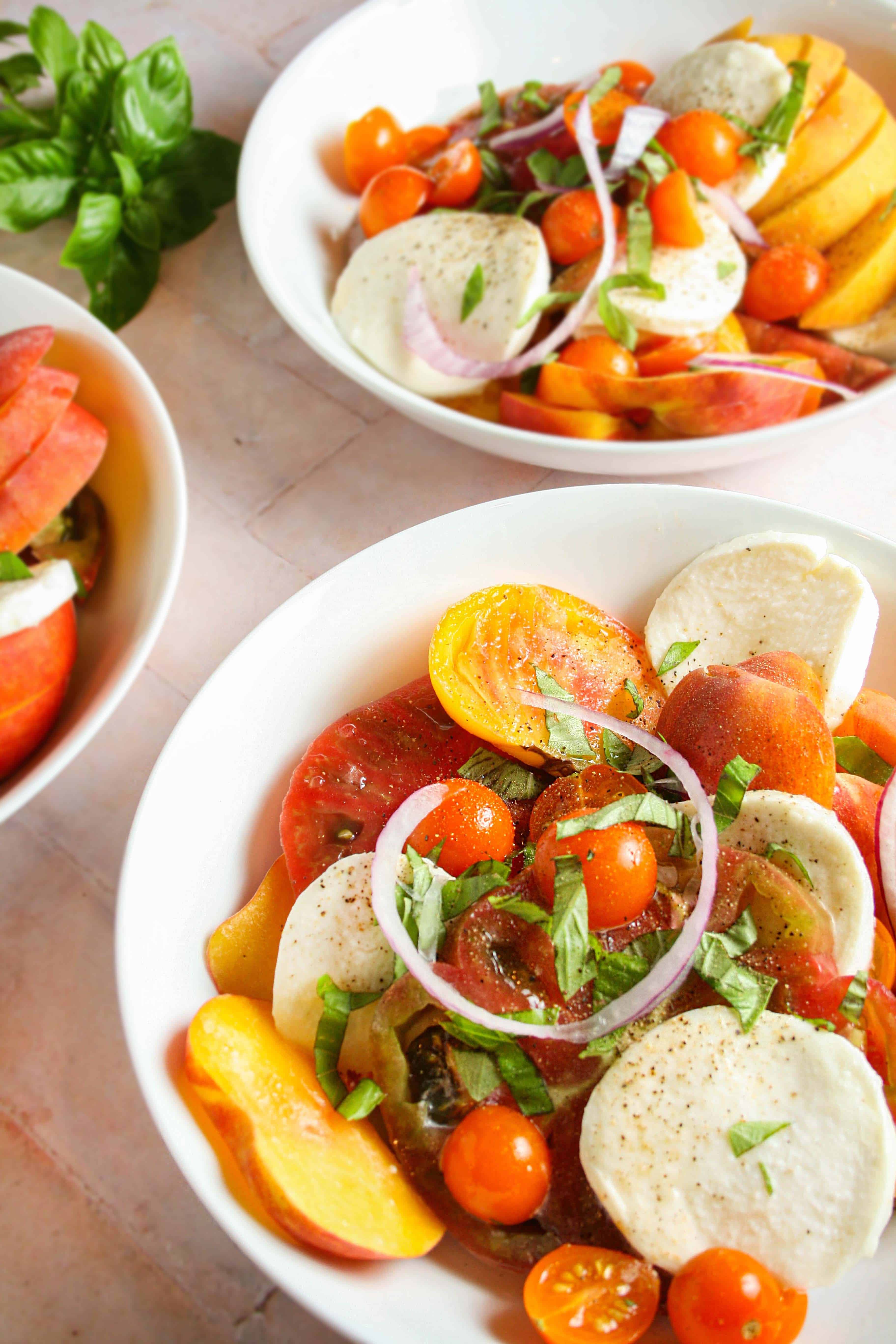 close up photograph of stone fruit caprese salad