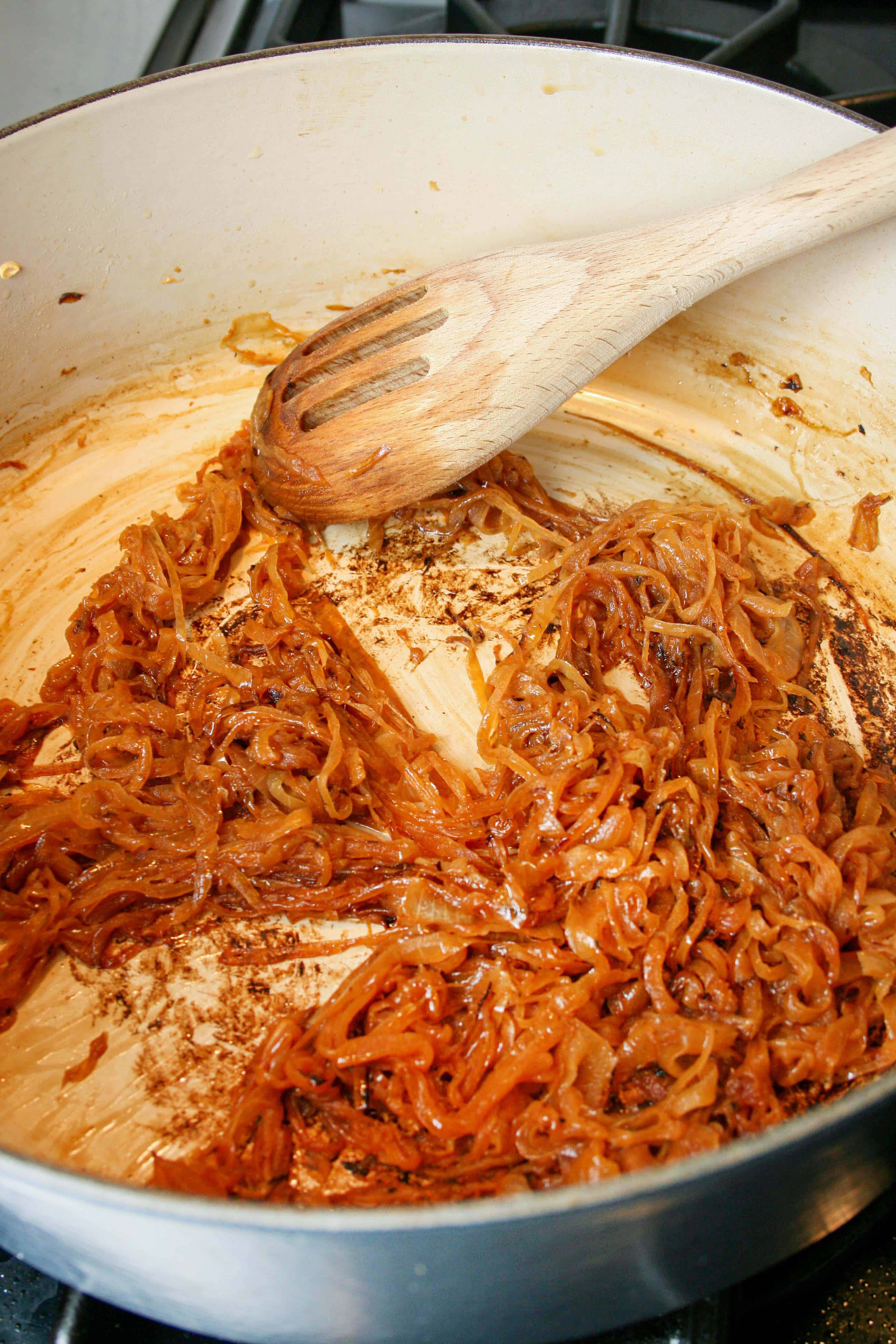 Photograph of caramelized onions in a dutch oven pan