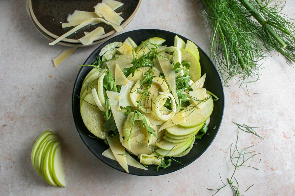 Photograph of shaved fennel salad with parmesan and green apple