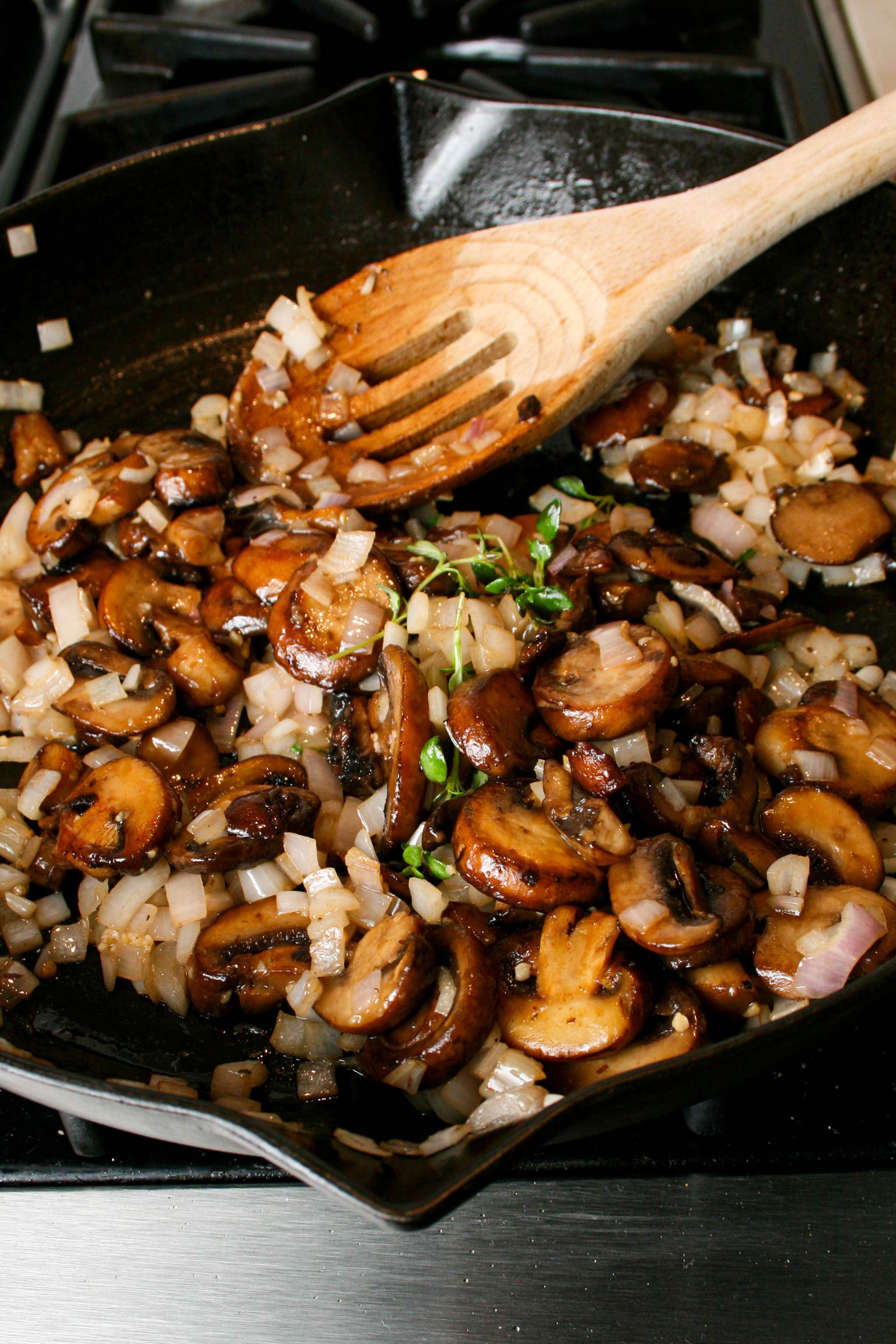 Sautéed mushrooms, shallots, garlic, and thyme in a cast iron skillet