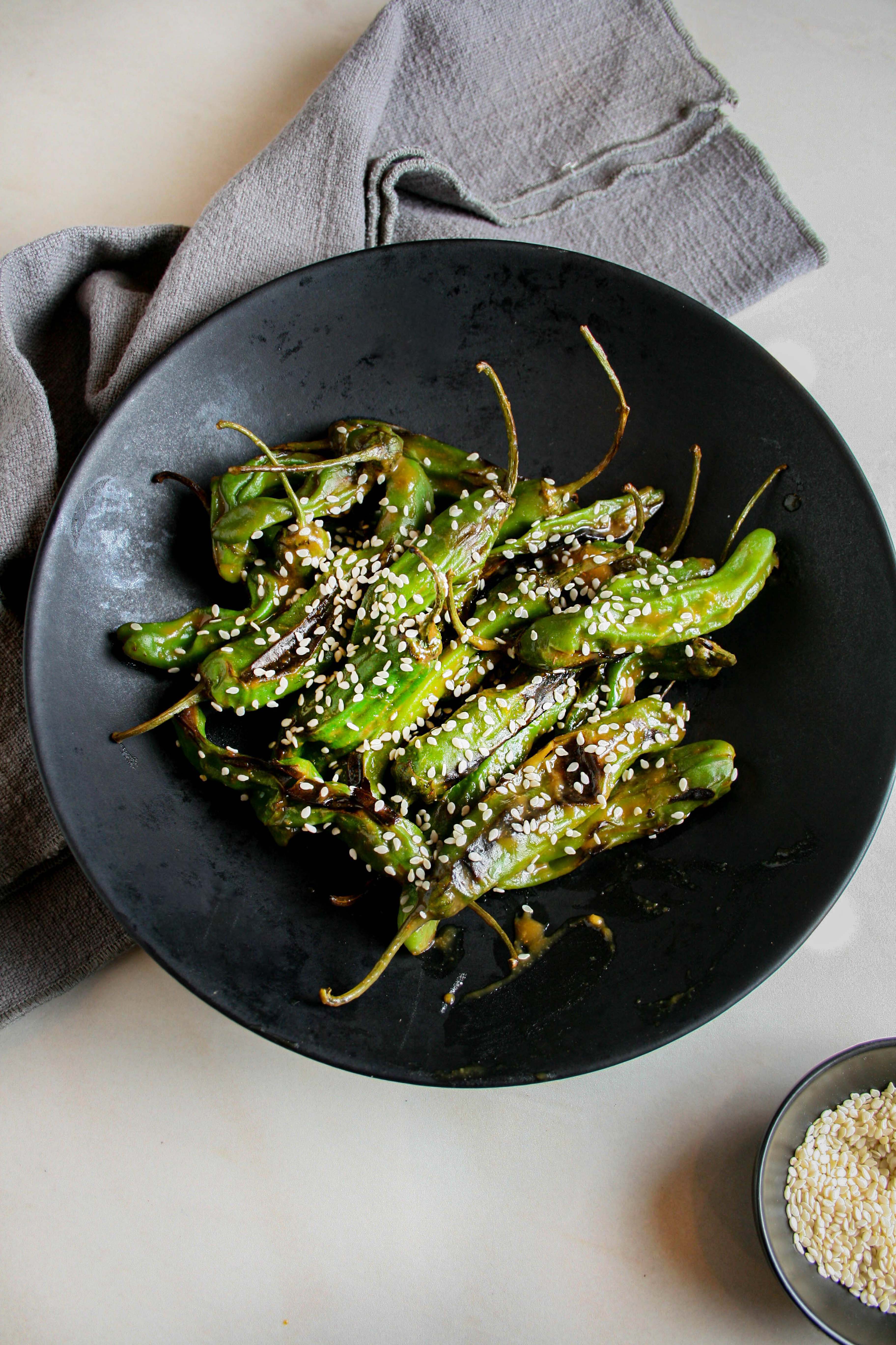 Hero photograph of miso shishito peppers